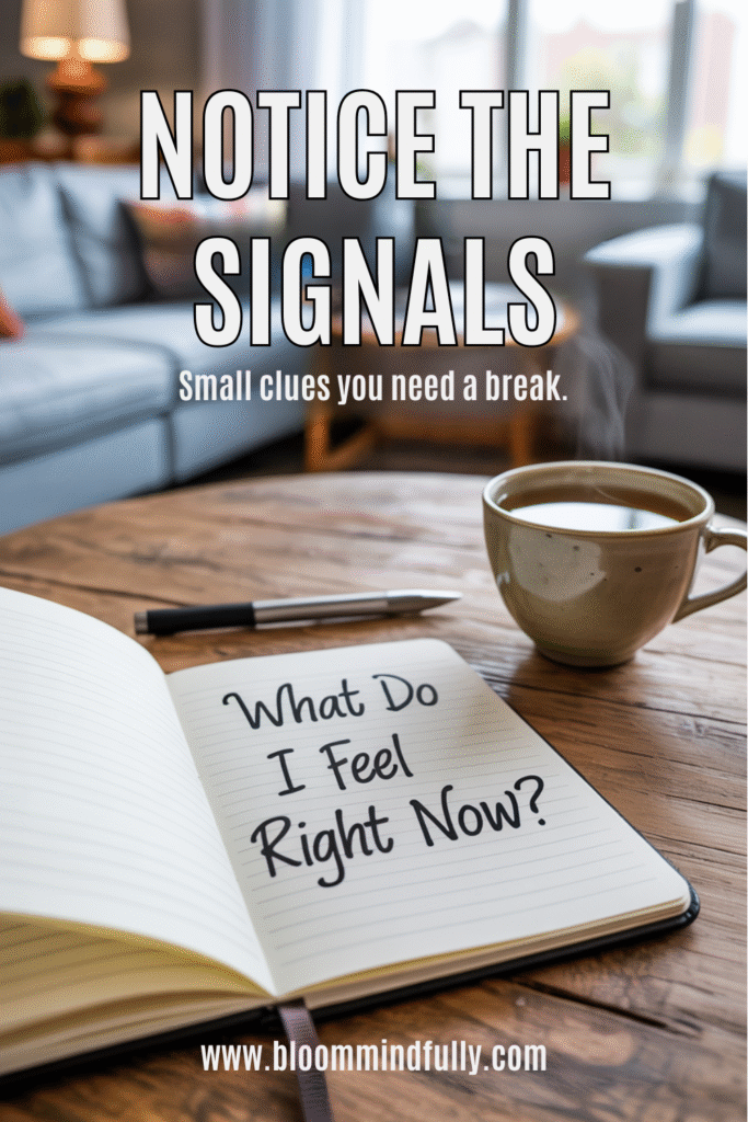 Open notebook on a coffee table with the words “What Do I Feel Right Now?” beside a steaming mug, encouraging using your senses for calm and living with mindfulness.