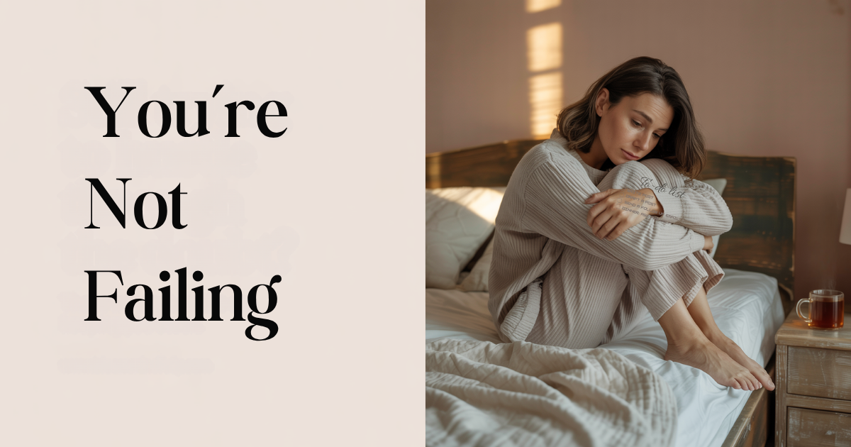 Woman sitting on bed in cozy clothes, looking thoughtful with text reading “You’re not failing,” capturing mindset reset for overwhelmed moms.