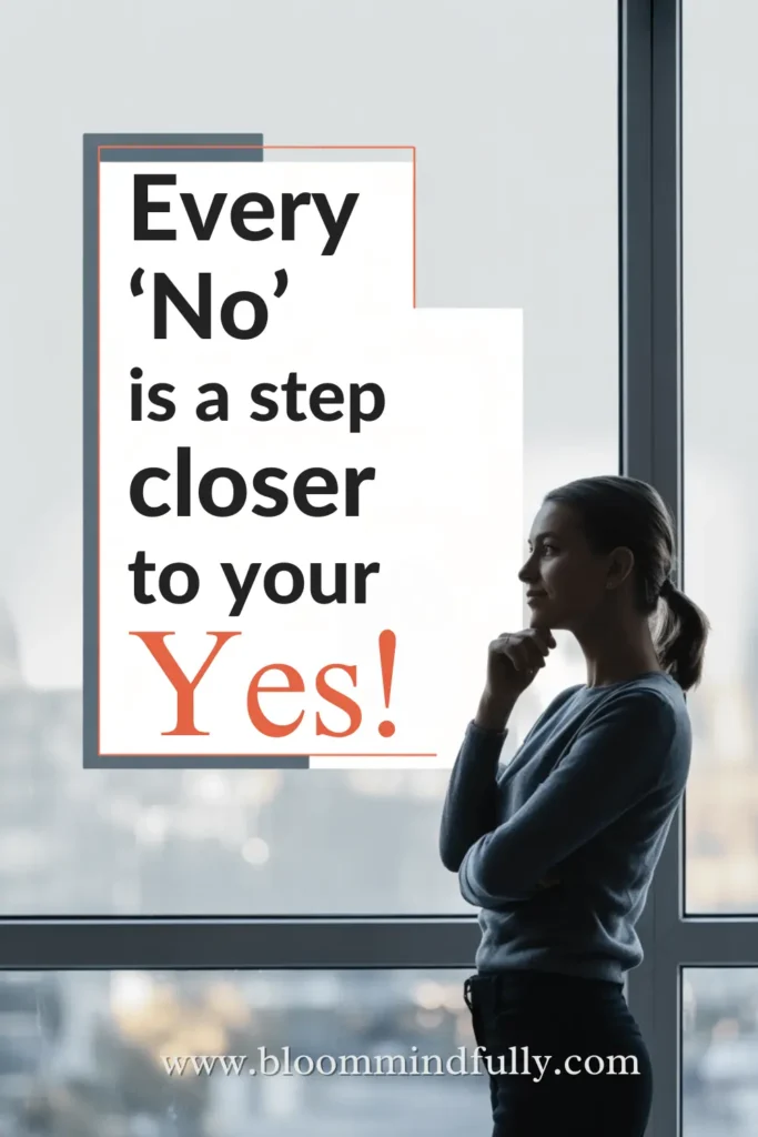 Woman standing confidently by a window with the quote “Every ‘No’ is a step closer to your Yes!” in bold serif font—motivational message for entrepreneurs building a growth mindset in business.