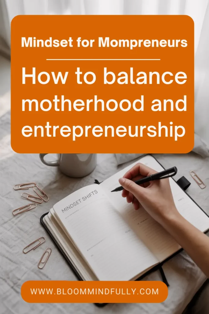 Close-up of mompreneur writing mindset shifts in journal with coffee and paperclips, showing mindset for mompreneurs to balance motherhood and business.