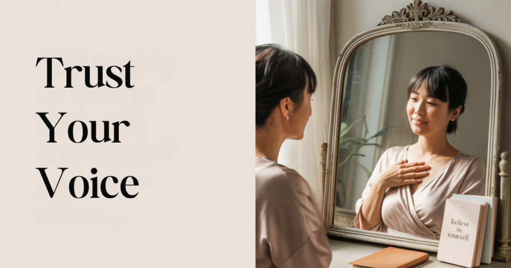 A mom entrepreneur places her hand on her heart in front of a mirror, modeling how to trust yourself as a business owner and build confidence as an entrepreneur mom.