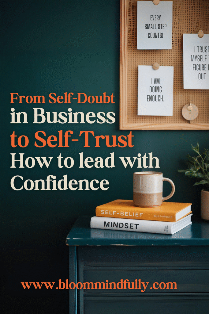 A cozy workspace with books labeled “Self-Belief” and “Mindset,” a mug, and empowering notes on the wall, showing how to overcome imposter syndrome in business with small mindset shifts and affirmations.
